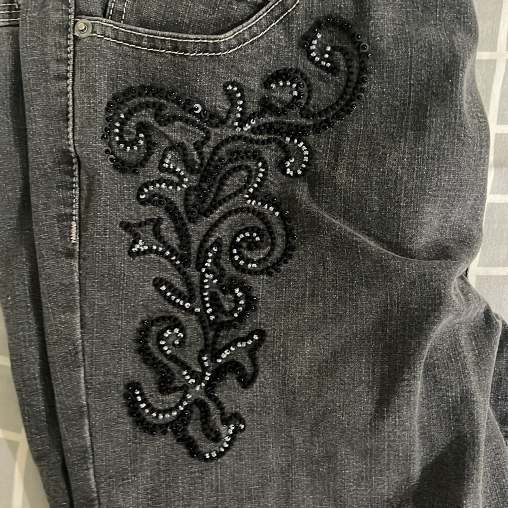 grey flared jeans with embroidery